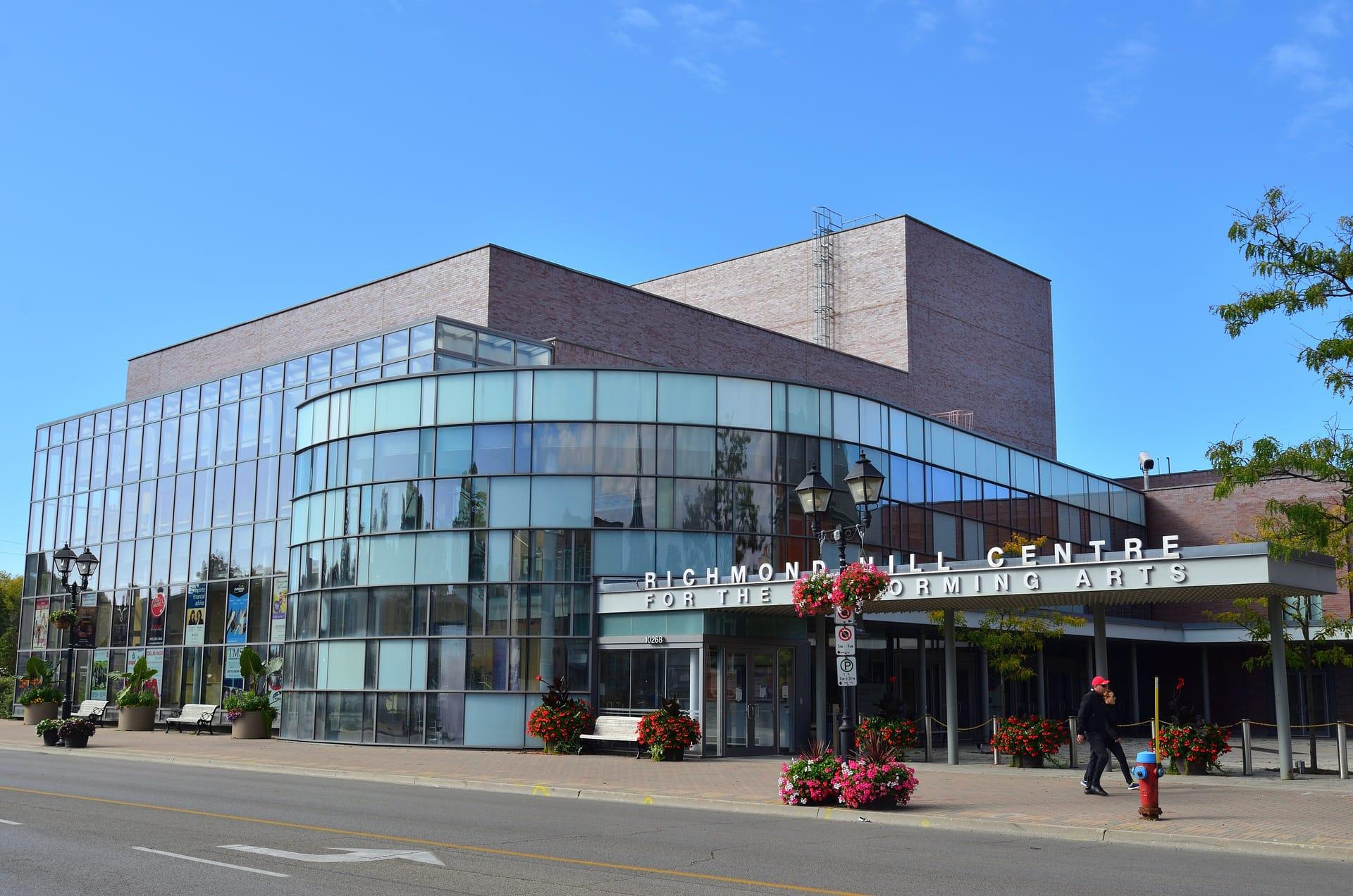 The glass front of the Richmond Hill Centre for the Performing Arts on a sunny day