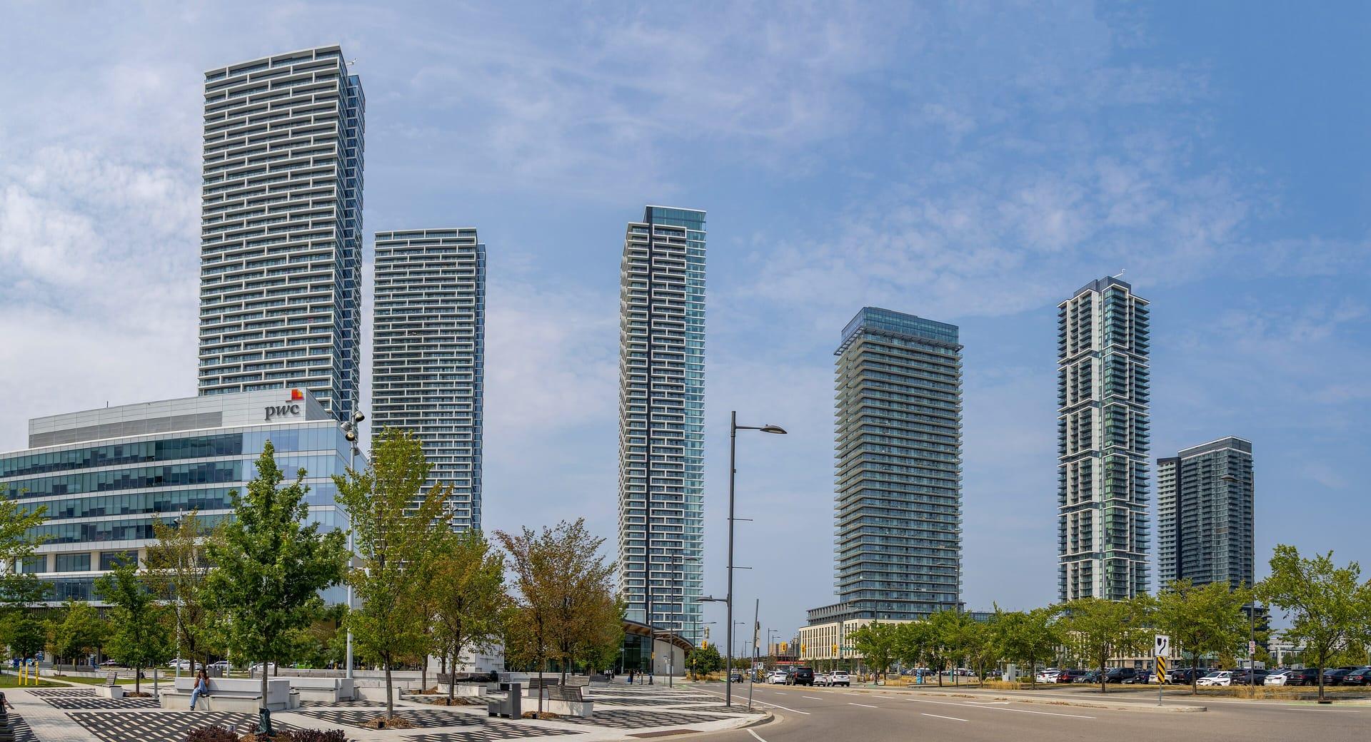 Glass towers of the Vaughan Metropolitan Centre against a summer sky